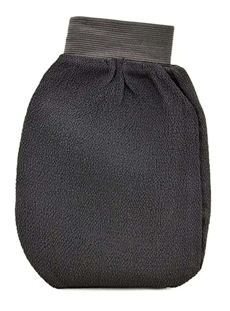 Compact folded black exfoliating kessa scrub mitt with elastic wrist band for easy storage
