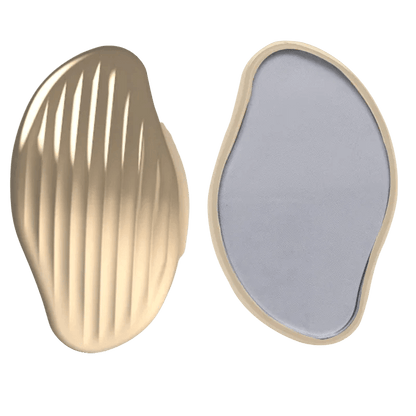 Gold nano glass hair eraser showing textured exfoliating side and smooth crystal surface for painless hair removal